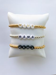 "A beautiful beaded bracelet with the word \"mama\" on it. Perfect for the mom, perfect as a gift and it especially makes a great Mother's Day gift. These are SUPER popular! Please choose your color of beads and if you would like it personalized with something other than \"MAMA.\" Thanks for looking and we hope you find something you adore." Personalized Letter Beads Bracelets, Adjustable Beaded Meaningful Bracelets, Adjustable White Jewelry For Mother's Day, Personalized Bracelets As Gift For Mom, Mother's Day Bracelet Jewelry Gift For Mom, White Adjustable Bracelets For Mother's Day, Adjustable White Bracelets For Mother's Day, Personalized Meaningful Beaded Bracelets As Gift, Mother's Day Gift Bracelet Jewelry For Mom