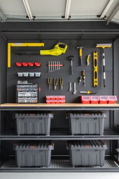 the garage is organized with tools and storage bins for all sorts of things to work on