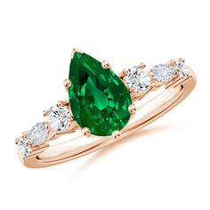 an emerald and diamond ring set in rose gold with diamonds on the band, featuring a pear shaped green tourmaline surrounded by white stones