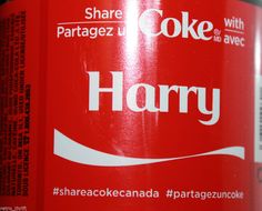 a close up of a can of coke with the word harry on it's side