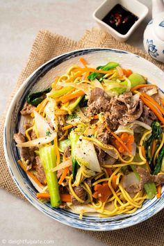 This quick and easy Vietnamese beef noodle stir-fry features tender beef, flavorful noodles and crisp vegetables. It is great for daily lunch and dinner as well as family celebration. Egg Noodle Dishes, Mi Xao, Vietnamese Beef Stew, Beef Noodle Stir Fry, Korean Glass Noodles, Beef Chow Mein, Vegan Beef, Stir Fry Noodles, Marinated Beef