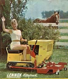 a woman riding on the back of a yellow lawn mower