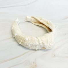 Elevate your style with our Pearl And Tweed Knotted Headband. Featuring a unique combination of pearls and tweed, this classic headband adds a touch of sophistication to any outfit. Perfect for any occasion, it's the perfect accessory to elevate your look. Dimension: Approximately 7” (L) x 5“ (W) x 2”(H) Made in China Stylish Scarves, Knotted Headband, Accessories Bags Shoes, Hair Setting, Pearl Cream, Pearl Headband, Shoe Gifts, Elevate Your Look, Knot Headband