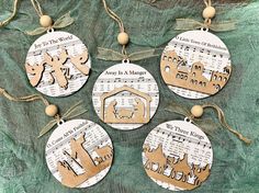 four wooden christmas ornaments hanging from twine