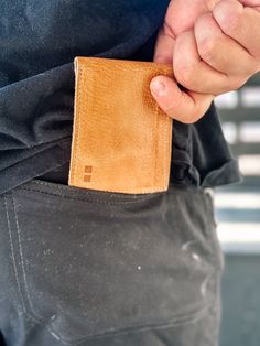 The Amidala Wallet in Teak Driftwood by BedStu combines timeless style with functional design, perfect for those who appreciate craftsmanship. Handmade from chrome and formaldehyde-free, vegetable-tanned leather in Leon, Mexico, this classic bifold wallet is designed to tuck away your cash and cards in style. With 4 credit card slots and a larger horizontal pocket for cash, the Amidala ensures your essentials are always within reach. Measuring 4 ¼" W x 3 ¼" H when closed and 8 ½" W when open, it’s the perfect size for him or her—whether carried in a back pocket or thrown into your favorite handbag. Features and Benefits: Made from eco-friendly, chrome and formaldehyde-free, vegetable-tanned leather Classic bifold design for a timeless look 4 interior credit card slots and a larger pocket f Classic Bifold Wallet With Leather Patch, Modern Wallets With Leather Lining For Everyday Use, Cognac Card Holder With Rfid Blocking For Everyday Use, Classic Trifold Wallet In Cognac For Everyday Use, Leather Card Holder With Coin Pocket For Everyday Use, Modern Brown Wallets With Rfid Blocking, Classic Cognac Trifold Wallet For Everyday Use, Cognac Rfid Blocking Card Holder For Everyday Use, Brown Leather Wallet With Leather Patch