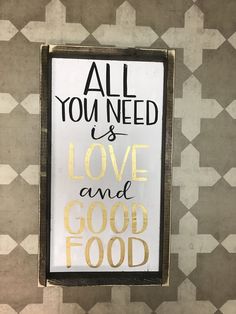 a sign that says all you need is love and good food