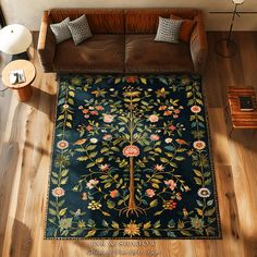 an overhead view of a living room with a couch, coffee table and rug on the floor