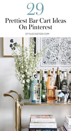 a bar cart with liquor bottles and flowers on the top, in front of a mirror that says 29 prettiest bar cart ideas on pinterest