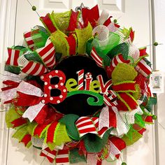 a christmas wreath with the word believe on it