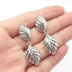 Great vintage condition.  925 Sterling Silver Vintage Floral Leaf Dangling Drop Earrings  Weight: 7.1g   WELCOME TO PAWN SHOP We are an actual pawn shop and have been in business for over 25 years. Since 1990, our establishment has been serving a variety of clients by providing them with short term cash solutions and options of liquidity regarding their treasured heirlooms. Acknowledging that today′s customers are very sophisticated and are looking for a variety of investments, our acquisitions Artistic Earrings, Vintage New York, Pawn Shop, Hook Earrings, 25 Years, Link Bracelets, Vintage Floral, Charm Pendant, Etsy Gifts