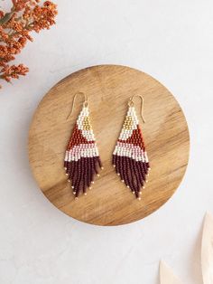 Say hello to the Desert Mountain Beaded Fringe Earrings, featuring Toho Seed beads in warm earth tones. Perfect for a summer adventure in the desert mountains, these stylish earrings are sure to catch some attention. Perfect Size: Measuring 3" long and 1" wide, these earrings are the ideal size to make a bold statement while remaining elegant and sophisticated. Lightweight: Experience all-day comfort with earrings that are designed to be lightweight and easy to wear, without compromising on styl Desert Mountains, Beaded Fringe Earrings, Stylish Earrings, Beaded Earrings Patterns, Stylish Earring, Beaded Fringe, Summer Adventures, In The Desert, Earring Patterns