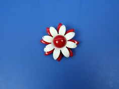 Vintage RED + WHITE Mod Flower Metal Enamel Pin / Brooch. Measures 2.25 in. wide. Shows normal vintage wear with some wear to the enamel coloring. I believe this pin also once had a stem (which has broken off, but does not affect the wearability of the pin). See photos + video for a closer look. Still wears beautifully! Makes a great gift. PS: I have other flower pins / brooches in my shop - be sure to check out my other listings! White Retro Brooch For Gift, White Retro Style Brooch For Gift, White Retro Brooches As Gift, Retro White Brooches As Gift, Vintage White Flower Brooches, White Vintage Flower Brooches, Vintage White Flower Brooch, Vintage White Flower Enamel Pin, Vintage White Flower Pins