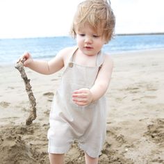 Perfect for summer days romping at the beach or every day, these gorgeous button overalls come in a gorgeous sand colour stripe, and featured press studs for easy nappy changes. Spring Beach Shortalls, Summer Cotton Shortalls For The Beach, Summer Cotton Shortalls For Beach, Summer Shortalls For Beach, Striped Cotton Jumpsuits And Rompers For Beach, Summer Beach Cotton Shortalls, Summer Beach Shortalls Overall, Summer Beach Shortalls, Beach Style Summer Shortalls