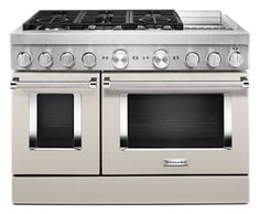 a double oven stove with two burners on the front and one in the back