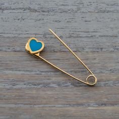 This is a safety pin brooch made of solid gold . The safety pin is 3.1cm(1.25 inches)long and weighs 0.6grams. Here is some details of the item: Gold-Glossy finish-Hand Made-Enamel-375 or 585 or 18K hallmarked Here is some informations about gold carat: Gold carat There are several carats available for gold. The carat is the gold content of the metal. The carat measures the proportion of pure gold mixed with other metal alloy to make up the final metal. The gold carats normally used in jewellery Gold Safety Pin Lapel Brooch, Gold Safety Pin Lapel Pin Gift, Gold Safety Pin Lapel Pin For Gift, Heart-shaped Gold Pins For Gifts, Safety Pin Heart, Safety Pin Jewelry, Safety Pin Brooch, Gold Baby, Pin Jewelry