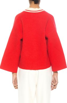 Warm and polished, this pocketed open-front cardigan offers work-to-weekend versatility. Open front Long sleeves 42% acrylic, 30% polyester, 28% polyamide Spot clean Imported Model stats: 5'10" height, 32" bust, 25" waist, 36" hip. Model is wearing size X-Small. Red Wool Sweater For Workwear, Red Wool Sweater For Work, Spring Workwear Turtleneck Cardigan, Spring Turtleneck Cardigan For Workwear, Spring Wool Cardigan In Solid Color, Red Wool Cardigan For Fall, Modern Red Outerwear For Fall, Modern Red Fall Outerwear, Red Open Front Spring Sweater