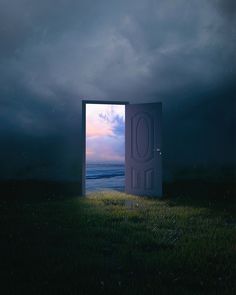 an open door in the middle of a grassy field at night with dark clouds above