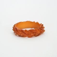 "vintage bakelite bracelet luminous butterscotch deeply carved & detailed leaf design crafted by true artisan very rare & collectible piece circa 1940's condition: very good measures approx: inner diameter : 2.5\" width: approx. .75\" circumference: 7.85\" item is vintage and is in used condition layaway is available ! message for more details" Vintage Carved Brown Bracelets, Vintage Brown Carved Bracelets, Vintage Carved Amber Jewelry, Vintage Amber Carved Jewelry, Vintage Carved Orange Jewelry, Vintage Orange Carved Jewelry, Orange Carved Vintage Jewelry, Far Rockaway, Bakelite Bracelets