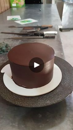 a chocolate cake sitting on top of a white plate