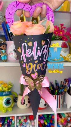 a person holding a bouquet of flowers in front of a shelf filled with other items