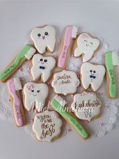 decorated cookies with toothbrushes and dental floss on a doily for a baby shower