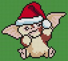 a dog with a santa hat on it's head is depicted in a cross stitch pattern