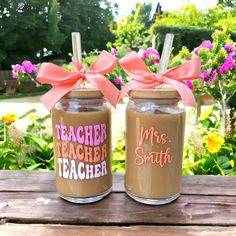 two mason jars with teacher and mrs smith written on them