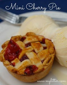 mini cherry pie on a plate with ice cream