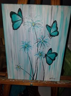 a painting with blue butterflies on it