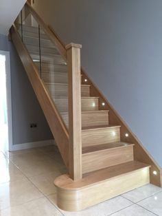 a stair case with lights on the bottom