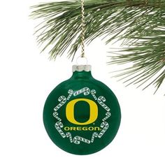 oregon ornament hanging from a pine tree