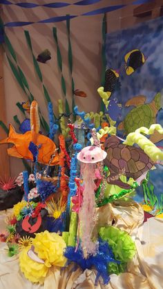 an assortment of sea life is displayed on a table