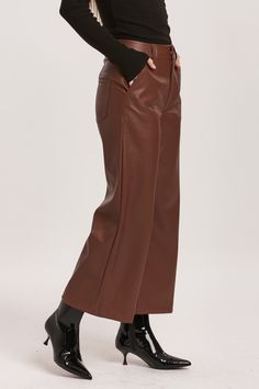 Super high rise cropped wide leg pants. A statement-making wonder resting at the natural waist, offering a relaxed silhouette in the hip and thigh. Cropped inseam on vegan leather accented with back patch pockets, wide hem opening, back darts for lift support, self covered button waistband closure.12 1/2" Front Rise (include waistband), 23" Leg Opening, 25" inseam (Size 27) COMFORT STRETCH: Slightly snug, give sometime to ease in, may go up one size 100% PU (VEGAN LEATHER) Hand wash cold (inside Brown Wide Leg Leather Pants For Fall, Leather Wide Leg Pants For Fall, Fall Leather Wide Leg Pants, Brown Wide-leg Leather Pants With Pockets, Brown Wide Leg Leather Bottoms, Brown Wide Leg Leather Pants With Pockets, Casual Brown Wide Leg Leather Pants, Fall Brown Wide-leg Leather Pants, Trendy Brown Wide Leg Pants For Fall