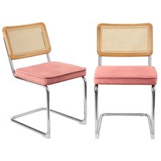 two chairs that are sitting side by side in the same color and pattern, one has a pink cushion on it