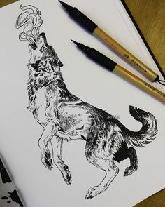 a drawing of a dog with horns on it's head and two markers next to it