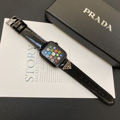 Premium Genuine Leather: Crafted from high-quality genuine leather, this Prada Apple Watch replacement strap offers a luxurious feel and exceptional durability, ensuring it withstands daily wear while maintaining its elegance. Iconic Prada Branding: Featuring the iconic Prada logo, this strap embodies the sophistication and high fashion synonymous with the brand, making it a prestigious accessory for your Apple Watch. Elegant and Timeless Design: The strap's classic design and luxurious leath... Luxury Durable Black Watch Bands, Luxury Adjustable Formal Watch Accessories, Prada Branding, Apple Wrist Watch, Apple Watch Design, Luxury Iphone Cases, Luxury Phone Case, Prada Logo, Iphone Leather Case