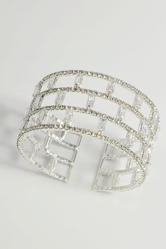 Introducing the Luminous Lattice Cuff Bracelet, a breathtaking creation designed to capture the spotlight. This bracelet features a unique lattice design, meticulously adorned with rows of sparkling rectangular and round-cut crystals that shimmer with every movement. Crafted with a flexible cuff style, it offers a comfortable fit while making a bold fashion statement. Ideal for glamorous evenings or as a luxurious gift, this piece promises to enchant and elevate any ensemble with its radiant ele Elegance Fashion, Lattice Design, Silver Cuff Bracelet, Bracelet Silver, Cuff Bangles, Bold Fashion, Lattice, Cuff Bracelet, Fashion Statement