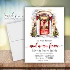 a christmas card with an image of a red door and wreath on it, next to a white envelope