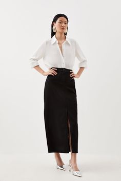 Reminiscent Of '90S Style, Yet Undeniably Fashion-Forward, This Denim Maxi Skirt Is A Wardrobe Essential For This Season And Next. Crafted With Light Wash Denim, This Piece Naturally Exudes An Off-Duty Mood. Elevate This Skirt With Heels And A Blouse For A Day-To-Evening Look, Or Pair With Trainers And A T-Shirt For An Effortless Everyday Outfit.Light Wash Denimfront Leg Slitfront And Back Pocketsbelt Loopsmaxi Hemline White Blouse Black Skirt Outfit, Maxi Skirt Office Outfit, Black Midi Skirt Outfit Work, Black Maxi Skirt Outfit For Work, Maxi Pencil Skirt Outfit, Black Denim Maxi Skirt Outfit, Work Outfit Skirt, Black Skirt White Top, Blouse Skirt Outfit