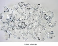 several pieces of clear crystal on a white surface