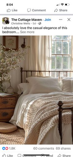 a bed with white linens and pillows in a bedroom next to a large window