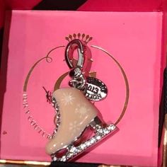 This Beautiful Juicy Couture Limited Edition Pink Ice Skate Charm Is A Very Rare One! Featuring Rhinestones On The Blade Of The Skate, Hand Painted Snowflake Design, Lace Up Wire Down The Front If The Skate, 2013 Limited Edition Juicy Couture Metal Tag. Brand New & Comes With Orginal Christmas Box. Rare & Vintage Smoke Free & Clean Home Poshmark 5 Star Seller Poshmark Ambassador Fast Shipper Packaged W/Care Juicy Couture Car Accessories, Charm Bracelet Juicy Couture, Wire Charm Bracelet, Juicy Couture Necklace Heart, Juicy Couture Charm Necklace, Juicy Couture Charms Bracelet, Multi Chain Bracelet, Juicy Couture Necklace, Juicy Couture Bracelet