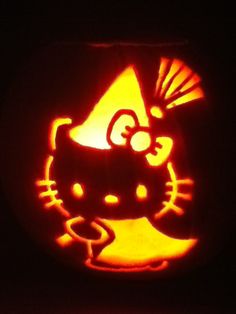 a pumpkin carved to look like hello kitty