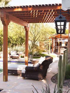 an outdoor living area with a pool and patio furniture