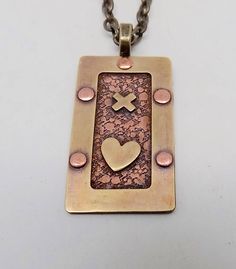 "Awesome mixed metal steampunk necklace . The size is 1 1/4\" by 3/4 \" and it has 24\" antique brass chain. I patina the body to give it a vintage look and the I sealed it to prevent tarnishing. All my jewelry come in a nice gift box." Riveted Jewelry, Rivet Jewelry, Metal Art Jewelry, Precious Metal Clay Jewelry, Chainmail Necklace, Steampunk Pendant, Copper Jewellery, Mixed Media Jewelry, Metal Clay Jewelry