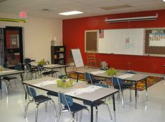 an empty classroom with desks and chairs