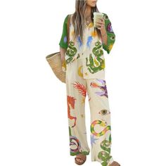 Discover Ultimate Comfort With Our Women's Summer Print Pajama Set. Perfect For Lounging Or A Restful Night's Sleep, This Set Features A Short Sleeve Button-Down Top And Drawstring Long Pants. Crafted From Soft, Skin-Friendly, And Breathable Fabric, These Pajamas Are Designed For Maximum Comfort. The Top Boasts A Relaxed Fit With 3/4 Sleeves That Can Be Rolled Up, Lapels, And A Trendy Print. The Shoulder Drop Design And Button Closure Add To The Ease And Style, Making It Ideal For Both Relaxation And Light Exercise. The Pants Feature A Drawstring Elastic Waist, Ensuring A Perfect Fit For All Body Types. With Wide-Leg, Straight Cut, And Two Side Pockets, These Trousers Provide Ultimate Graphic Print Shirt, Half Sleeve Shirts, Two Piece Pants Set, Oversized Blouse, Linen Style, Loose Outfit, Casual Sets, Summer Outfits Women, Pants Outfit