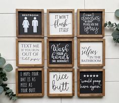 six wooden framed signs with different sayings on them, hanging on a white wall