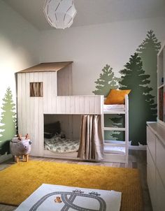 a child's bedroom with bunk beds and toys