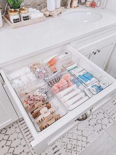 an organized drawer in the bathroom is shown